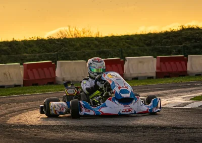 Ethan taking a corner in his kart during sunset