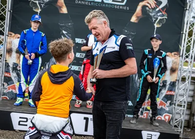 Ethan accepting a trophy in the Daniel Ricciardo Series.